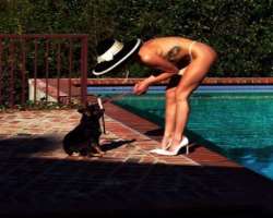 Kaili is accompanied by a cute dog in her home.